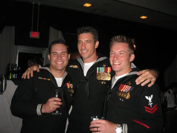 Three sailors in dress blues at the Navy Ball